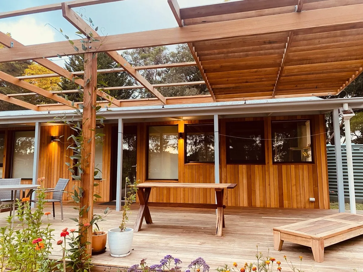 Wattle Flat timber deck, cedar cladding and outdoor living area with pergola