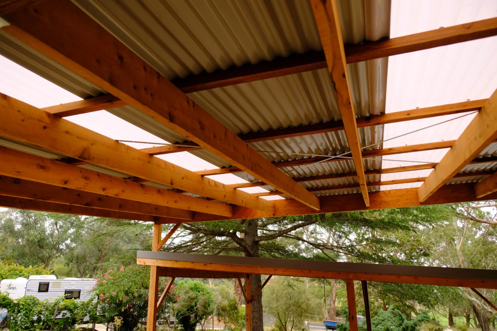 Timber pergola structure with the garden behind