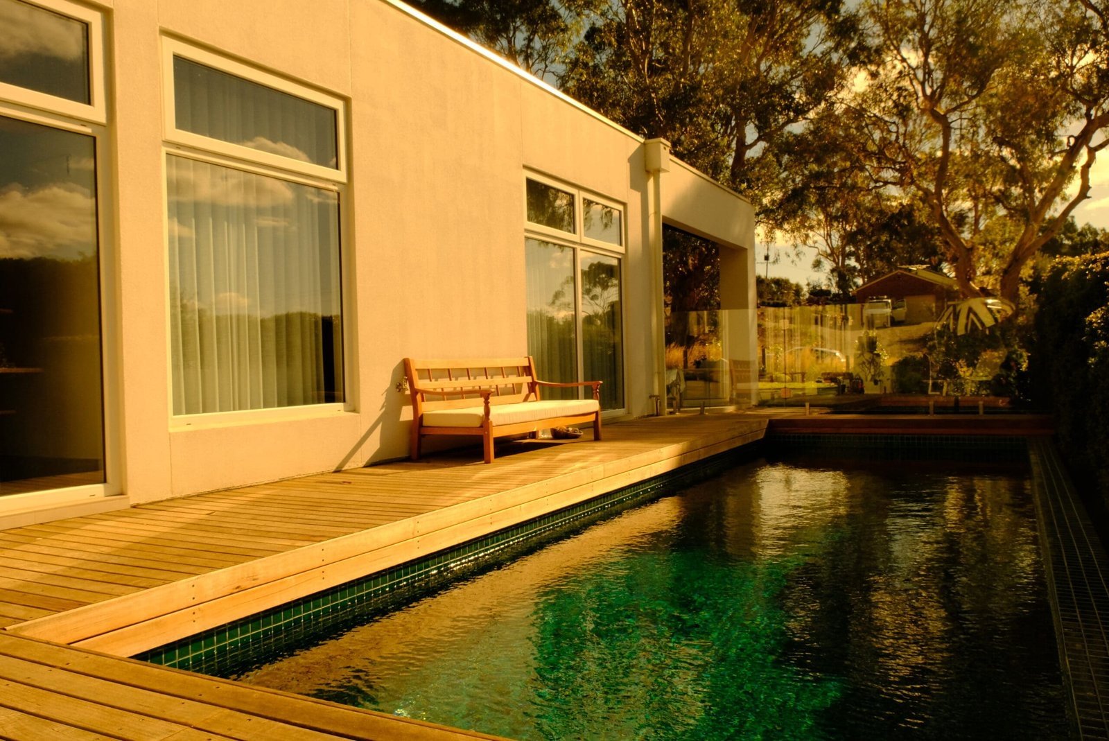 Wide view of pool and surrounding deck